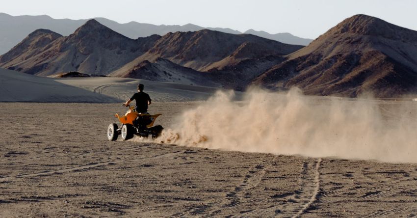 ATV - Man Riding Atv in Desert Viewing Mountain